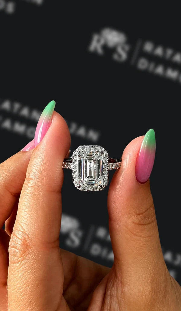 Three carat emerald cut natural diamond halo engagement ring