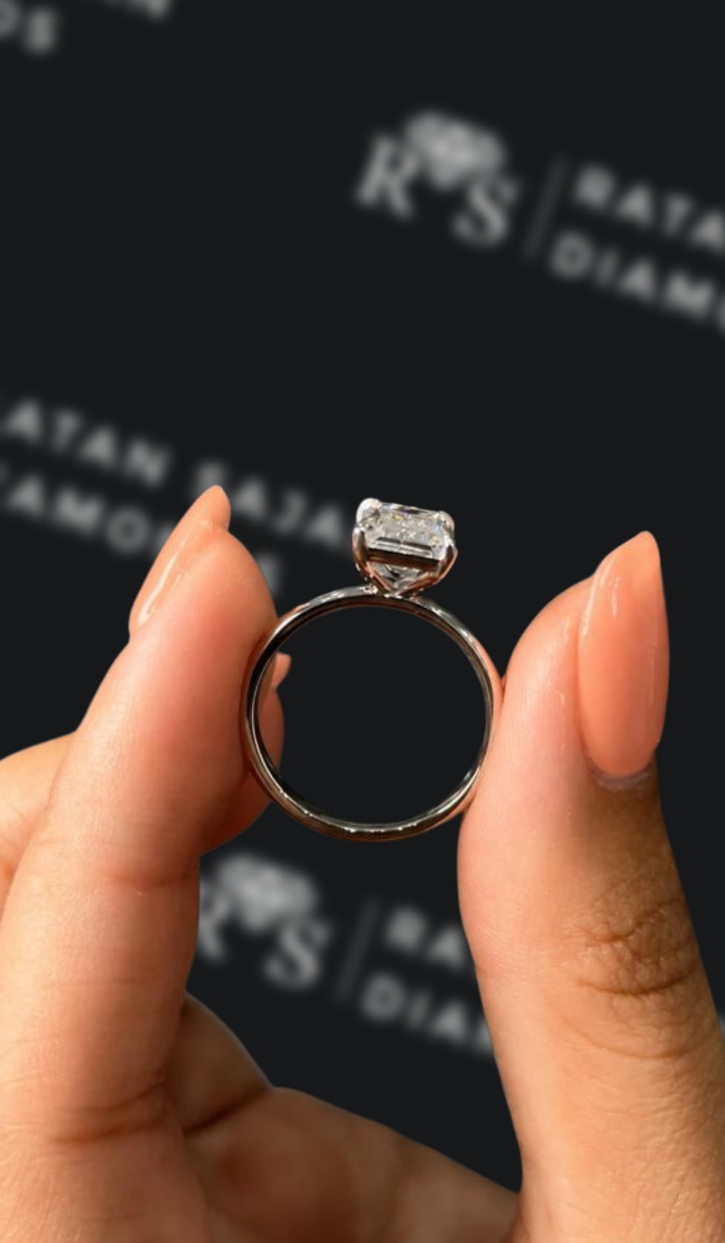 2 carat emerald cut natural diamond engagement ring by Ratan Sajan Diamonds Dubai